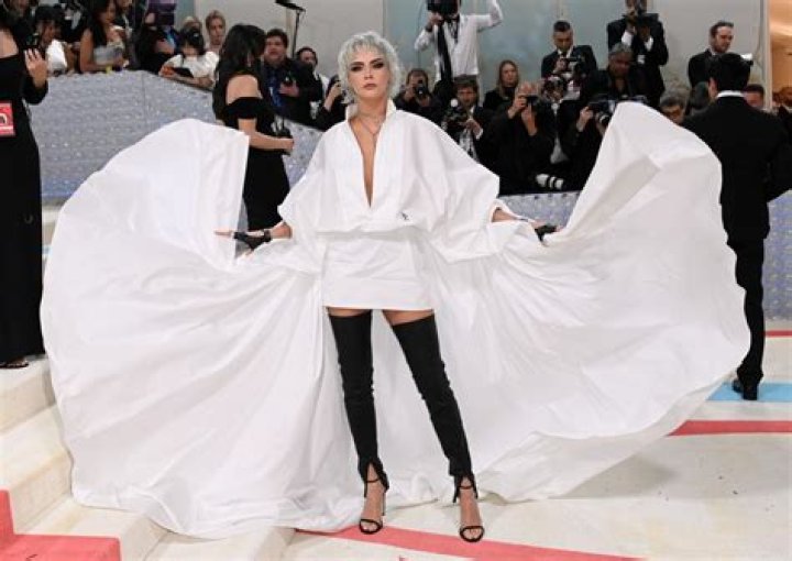 Cara Delevingne Turned Heads at the 2023 Met Gala in a White Cape Suit Dress: See Red Carpet Photos!